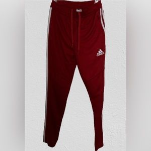 Adidas red casual pants w tie strings inside.. lines on each side w ankle zipper